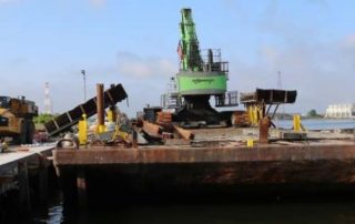 380 Development material handler positioned on a deck barge