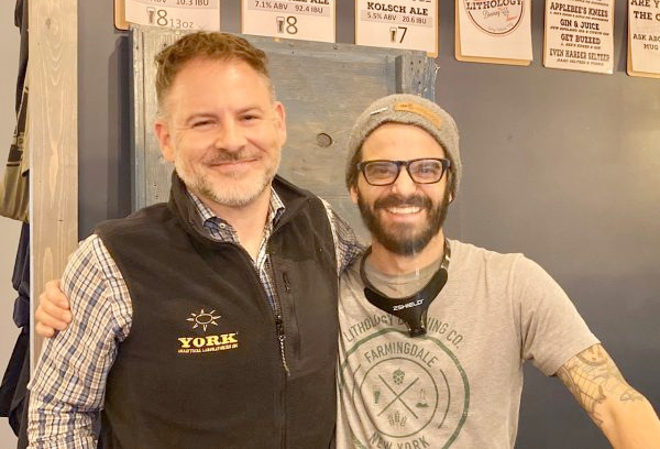 Michael Beckerich president and CEO of YORK Labs stands with a Lithology Brewing Company employee
