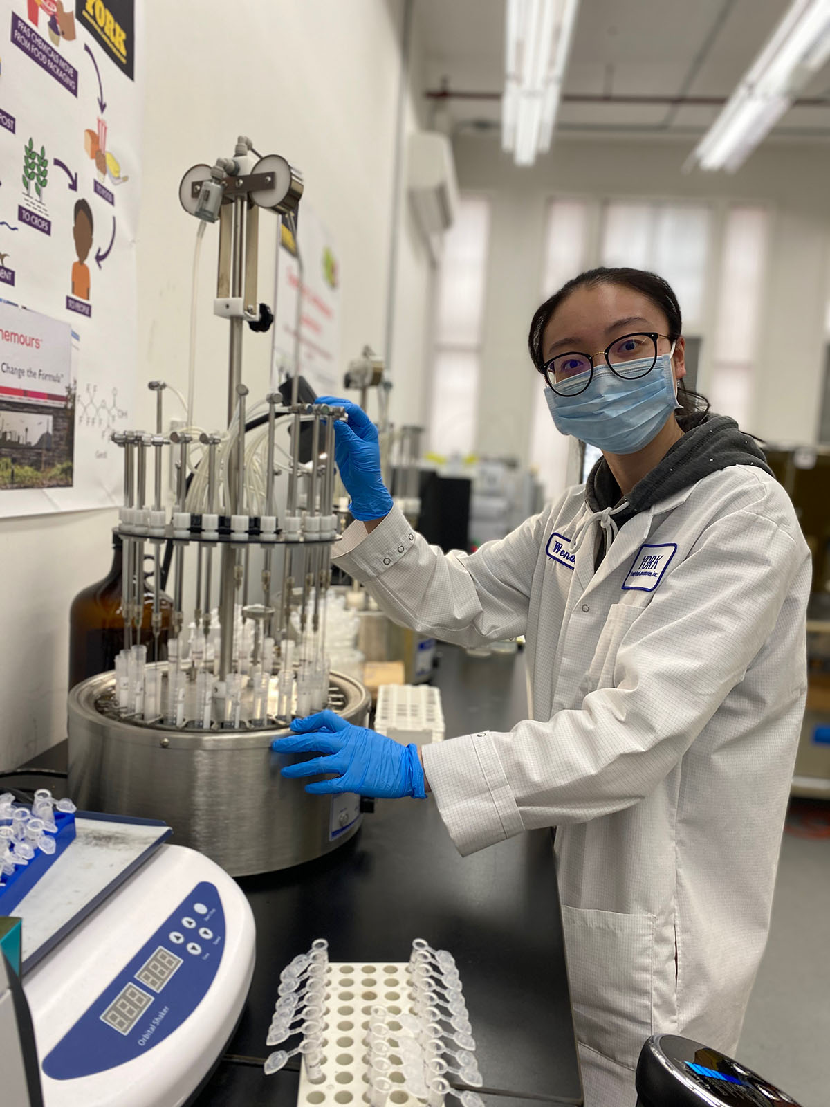 A YORK Labs employee wearing a white lab coat using equipment to perform a PFAS Analysis