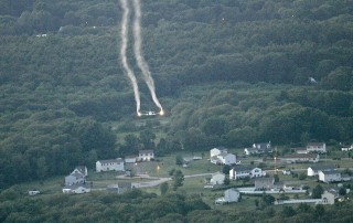 Mosquito pesticide containing PFAS contamination is aerially sprayed over land in New York