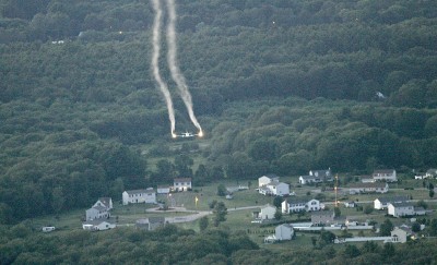 Mosquito pesticide containing PFAS contamination is aerially sprayed over land in New York